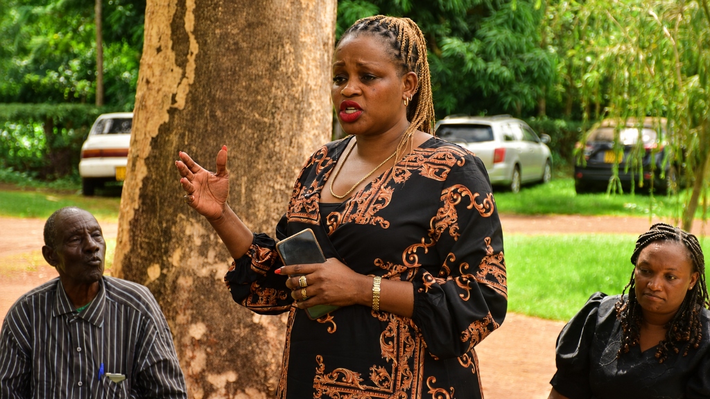 Madam Judith Kiragu addressing community members on empowerment