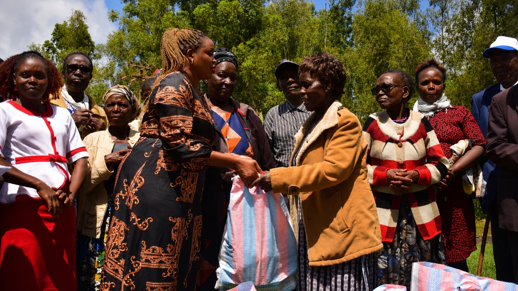Madam Judith Kiragu donating food packages to vulnerable community members